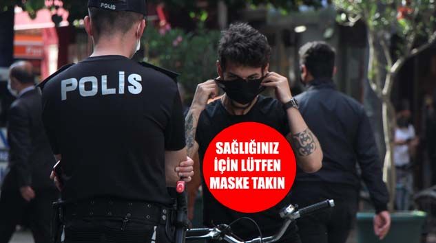 Polisi gören maskesine sarıldı