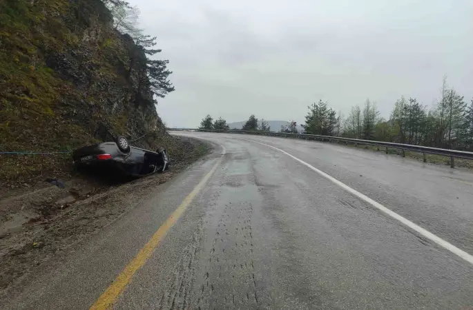 Takla atan otomobilden yara almadan kurtuldu
